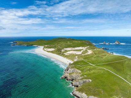Aerial view of Faraid Head peninsula with dunes and sandy beach