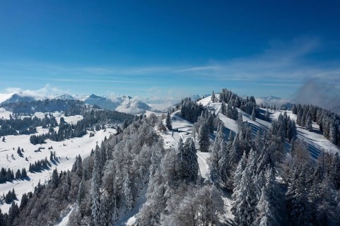 Winter landscape covered in deep snow on the Zwoelferhorn with a view of the Pillstein