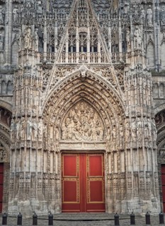 Notre Dame de Rouen Cathedral entrance door. Architectural landmark facade details featuring styles from Early Gothic to late Flamboyant and Renaissance architecture