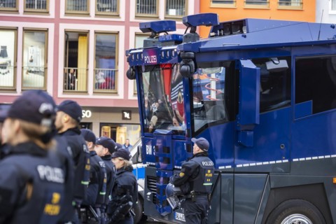 Water cannon and police in the city centre