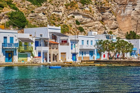 Close view of colorful village of Klima with Greek whitewashed houses on sunny day