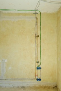 Power and network cables on a wall