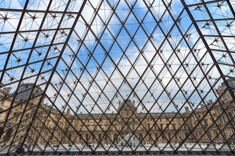 View from inside the pyramid to the buildings of the Louvre