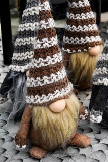 Dwarfs with long beards and huge woolly hats in a garden centre