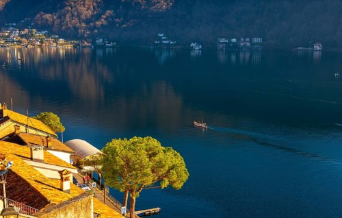Cityscape and Lake Lugano with Blue Sky and Mountain in a Sunny Day in Morcote