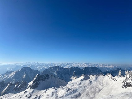Bloick from the Zugspitze summit on ski lifts and main Alpine chain