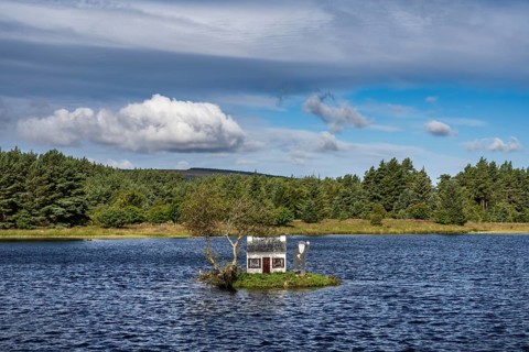 Small house called The Wee House on an island in Loch Shin