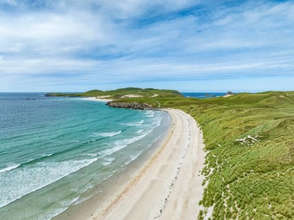 Aerial view of Balnakeil Beach and the Faraid Head peninsula with sandy beach and dune landscape