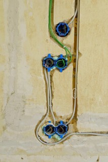 Power and network cables on a wall