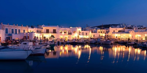 Traditional Greek fishing village and harbour after sunset