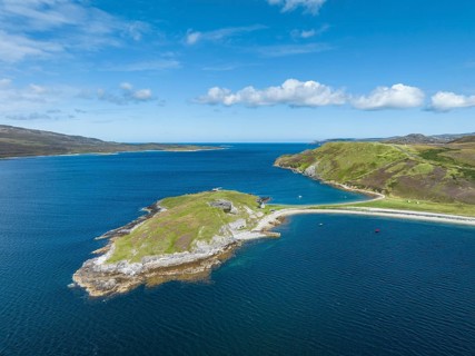 Aerial view of the Ard Neaki peninsula in the sea loch of Loch Eribol with the abandoned lime kilns and ferry house