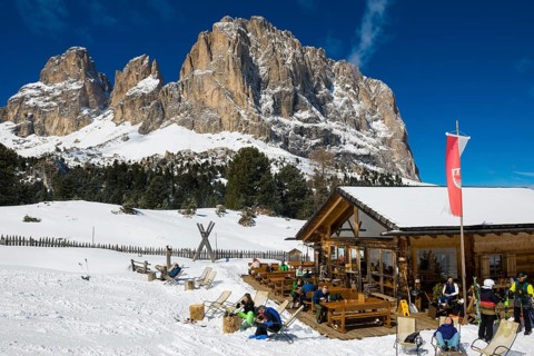 Snow-covered mountains and ski hut