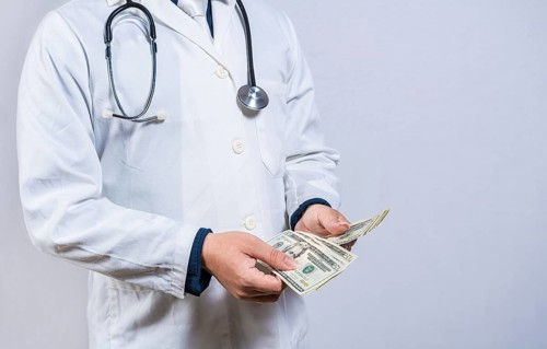 Medical corruption concept. Corrupt doctor counting money isolated