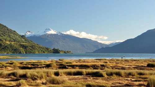The Estero Reloncavi near Cochamo in southern Chile with the snow-capped volcano Yate