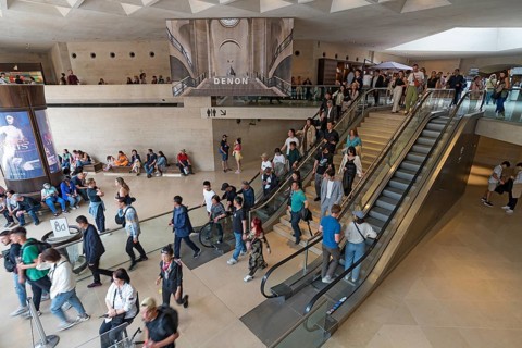 Visitors in the basement of the Louvre pyramid