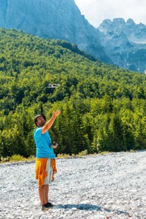 Drone pilot man taking off exploring new places in the mountain. Use of drone photography