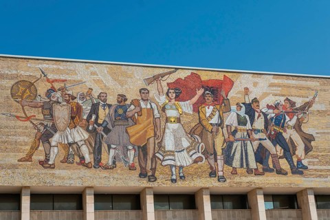 Beautiful painting of the revolution at the entrance to the National Historical Museum in Skanderbeg Square in Tirana. Albania