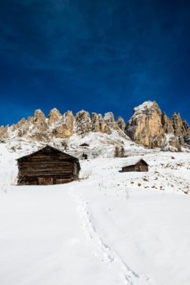Snow-covered mountains and alpine hut