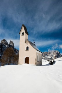 Snow-covered mountains and chapel