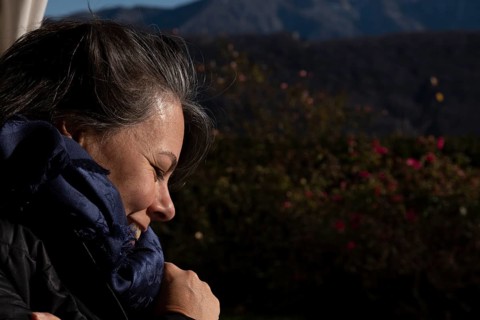 Headshot of a Happy Woman with Sunlight in Lugano