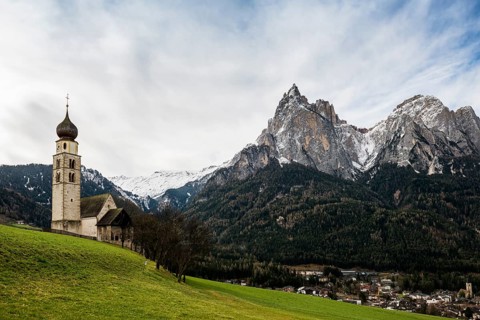 Snow-covered mountains and church