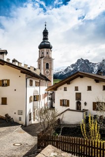 Village and snow-capped mountains