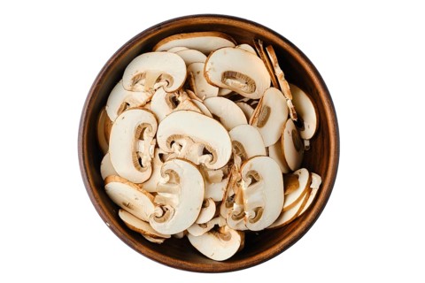 Top view of bowl with sliced brown cap champignons isolated on white background
