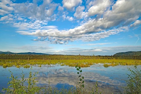 Clouds reflected in a crystal clear