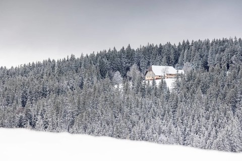 Old farm snowed in