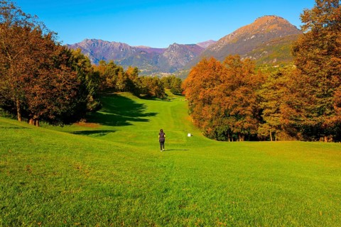 Golfer on Hole 1 in Golf Course Menaggio with Mountain View in Autumn in Lombardy