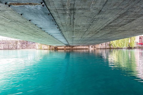 River Aare in City of Thun and Under the Bridge in a Sunny Summer Day in Thun