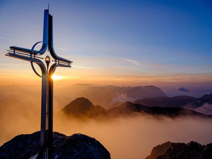 Summit cross Hoher Goell at sunrise