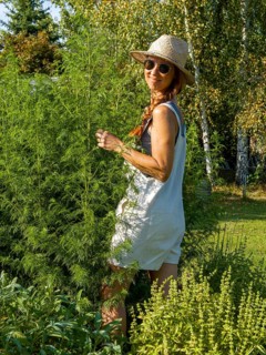 Woman in herb bed