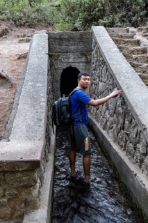 Tourist walks into the walk-in tunnel
