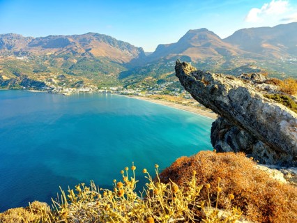 View over a cliff onto the bay and beach of Plakias