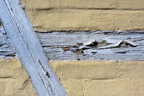 Half-timbered facade with peeling paint
