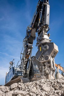 Black Liebherr crawler excavator recycling on demolition site