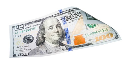 One hundred dollar bill falling or floating on empty background