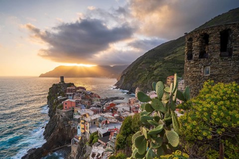 View of the colourful houses of Vernazza at sunset