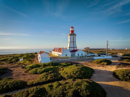 Aerial drone view of lighthouse on Cabo Espichel cape Espichel on Atlantic ocean