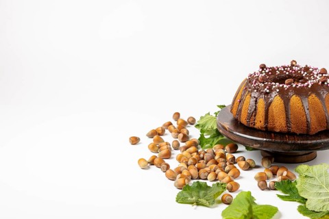 Vegan hazelnut cake on wooden serving plate
