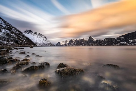 Snowy mountains by the fjord