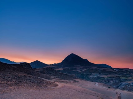 Mount Timios Stavros above harvested fields at dawn