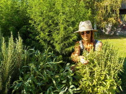 Woman in herb bed