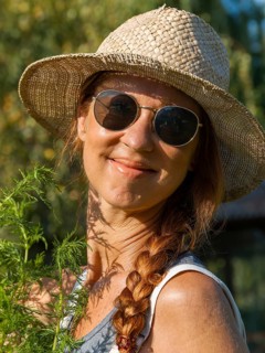 Woman in herb bed