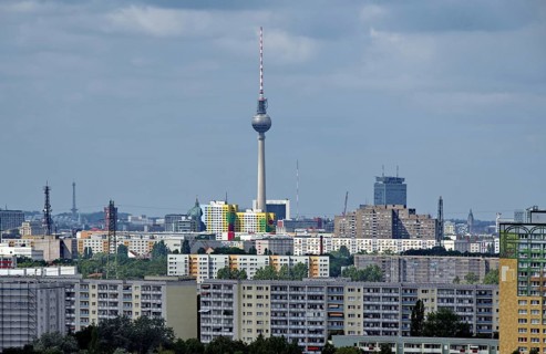 View through a telephoto lens from the Kienberg in the district of Marzahn-Hellersdorf to the TV tower in the district of Mitte