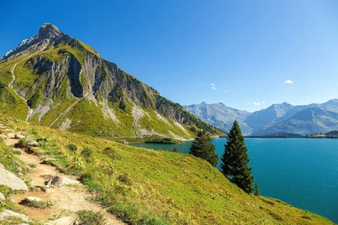 The Spullersee high mountain lake in Vorarlberg with a view of the Goppelspitz mountain