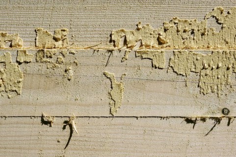 Wooden beams with remains of sawdust in a sawmill