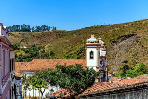 Tower of historic baroque church among the houses