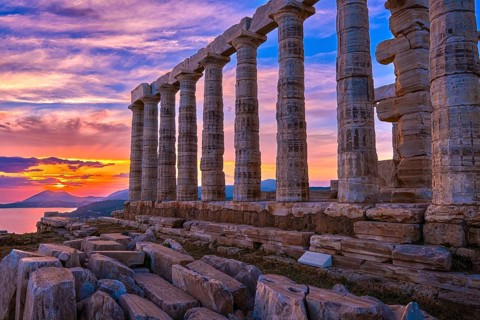 Beautiful sunset sky and ancient ruins of temple of Poseidon
